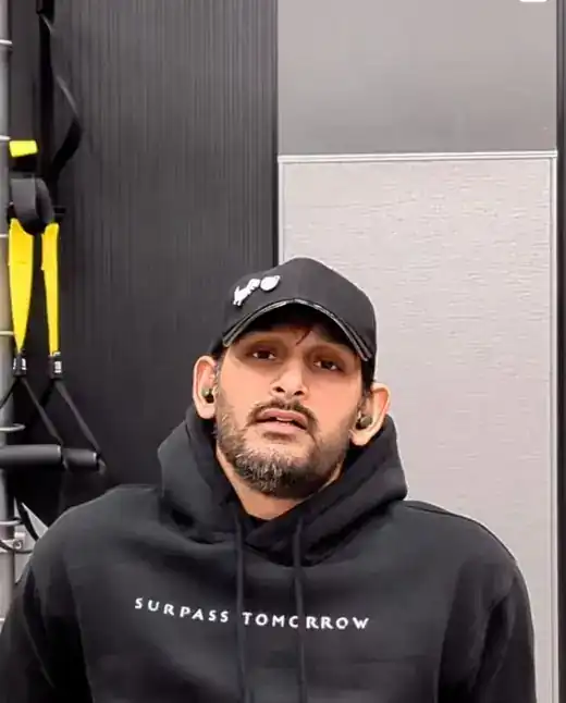 Coach Ali Yousuf in the Surpass Tomorrow hoodie